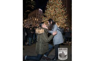 Marriage Proposal at Rockefeller Center Christmas tree. Photographer Vlad Leto