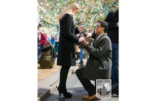 Secret Proposal at Rockefeller Center Christmas tree. Photographer Vlad Leto