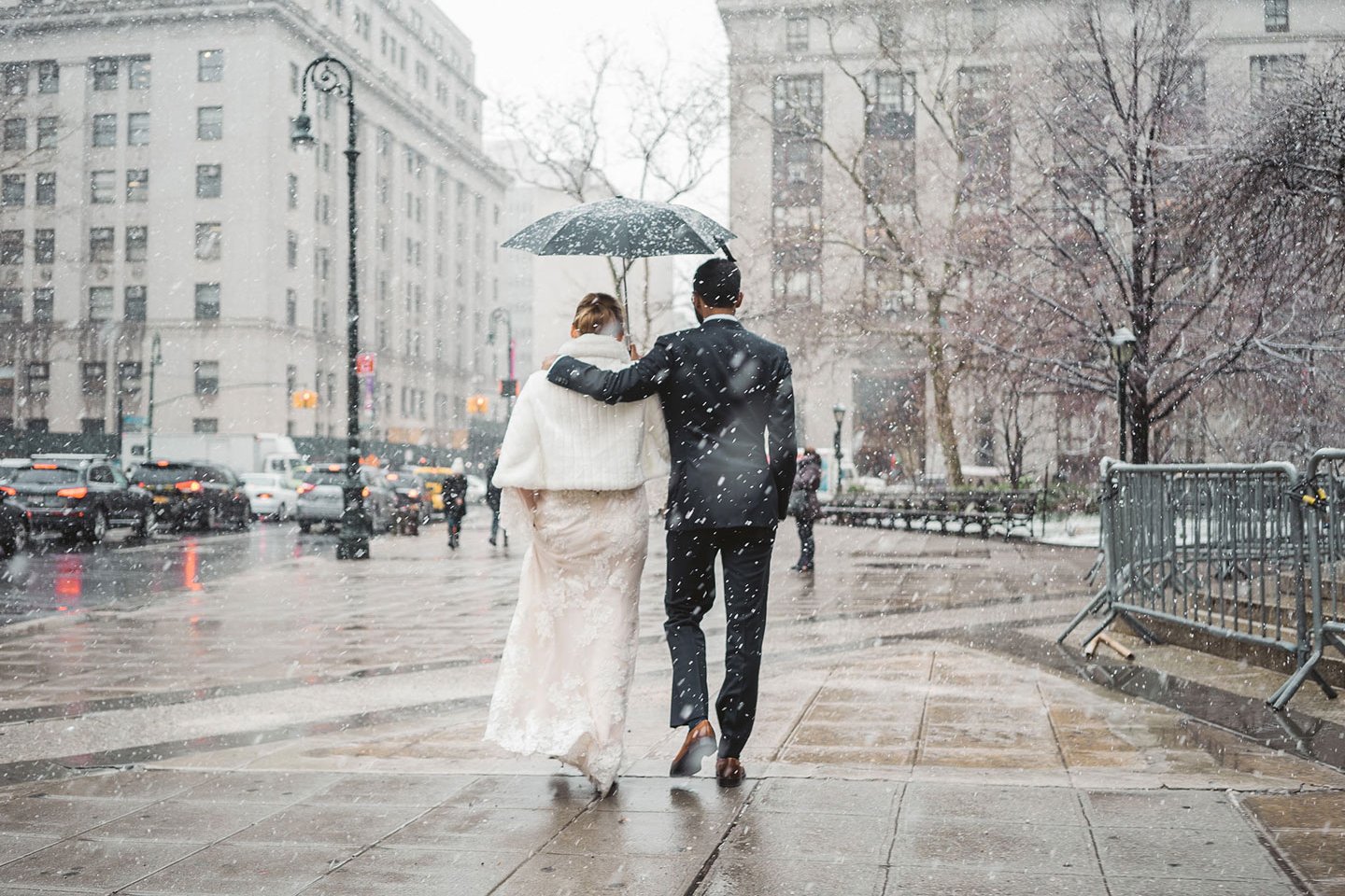 Photo of just married couple in NYC under the snow