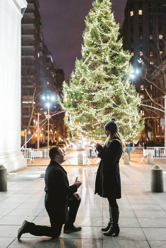 proposal under washington square christmas tree