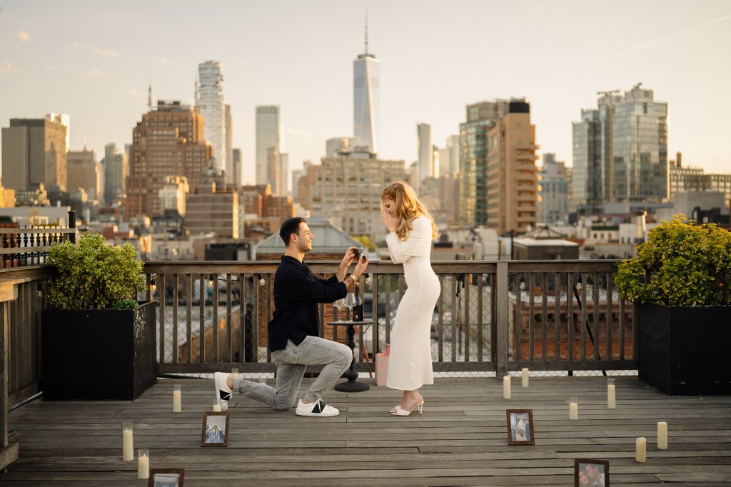 Surprise proposal on a private Manhattan rooftop with the Downtown skyline and One World Trade Center behind